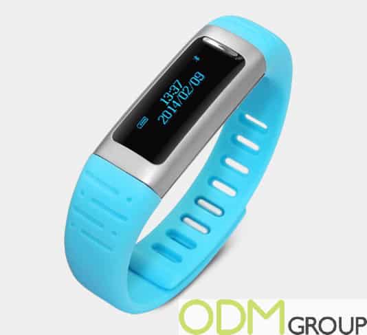 Blue fitness tracker with a digital display, perfect for promoting health and wellness.
